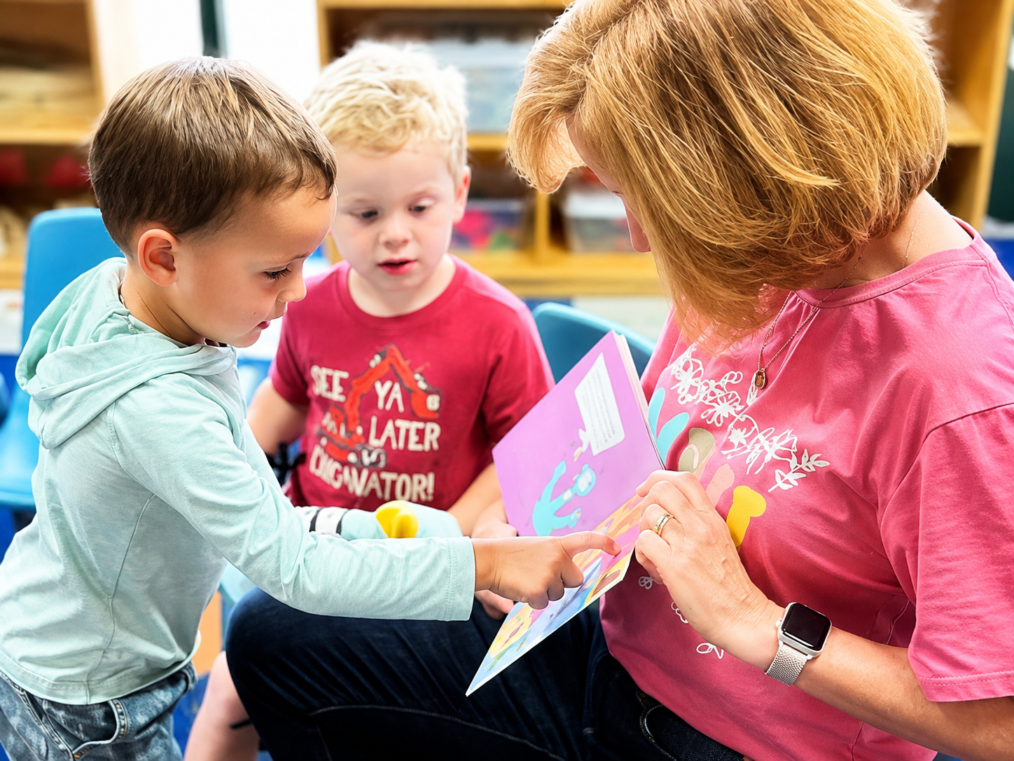 a teacher teaching with the kid